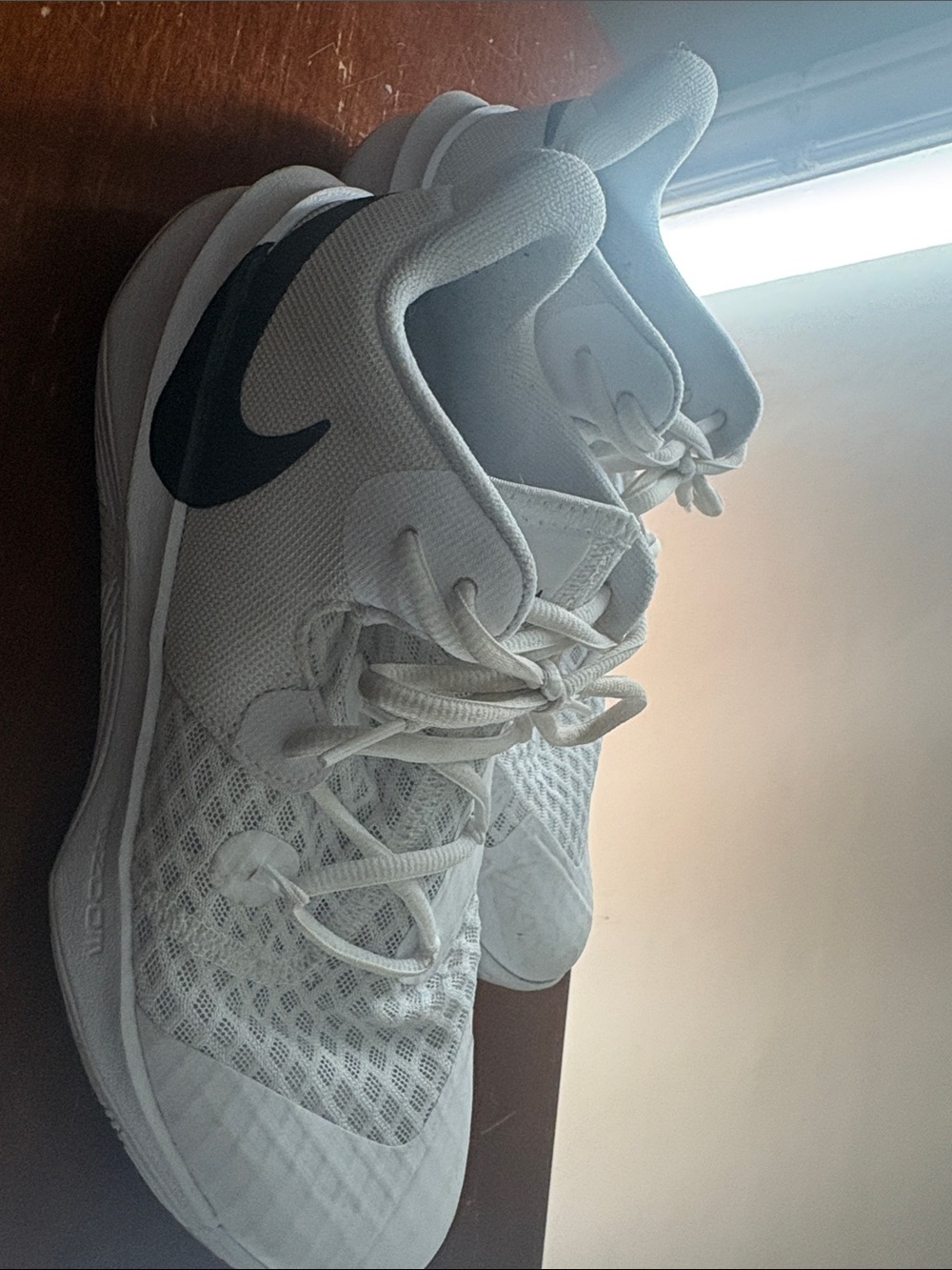 Nike Women’s White Athletic Sneakers with Black Swoosh